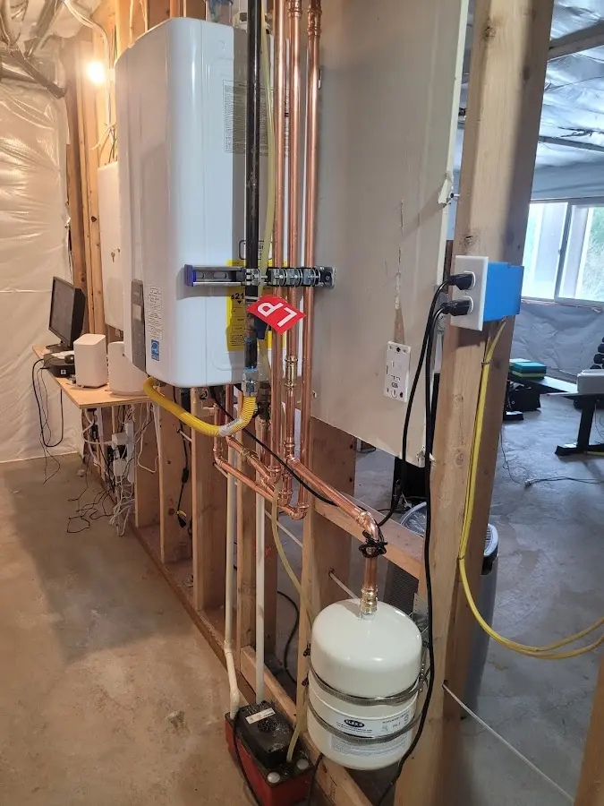 Licensed plumber repairing a kitchen sink in Lowell